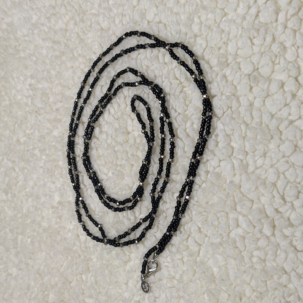 Long black silver beaded Cookie Lee necklace.